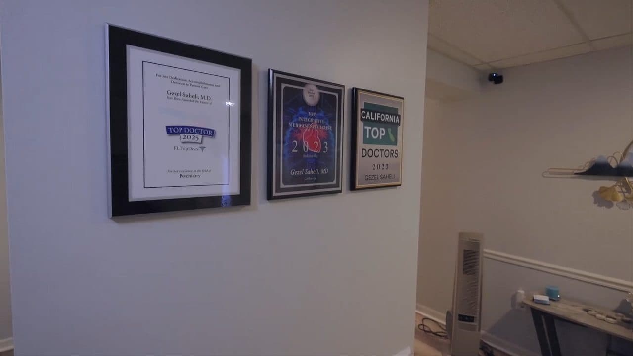 Physician awards on the wall of the Atlantis clinic